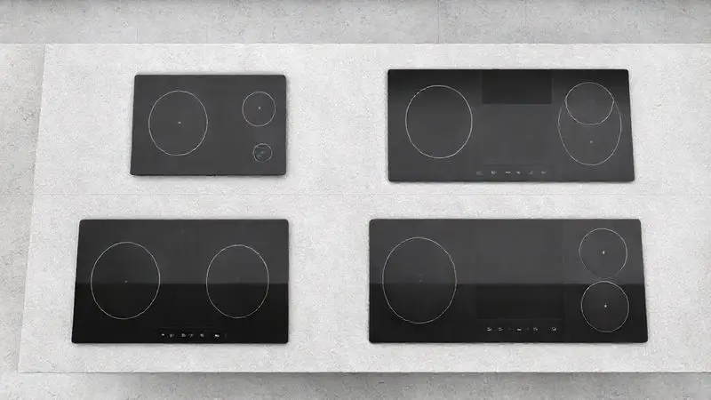 Render 3D mostrando diferentes tipos e tamanhos de cooktops de indução, como modelos de uma e quatro bocas, em uma bancada moderna.